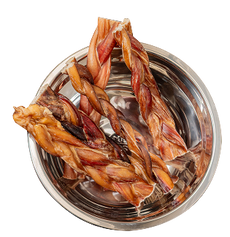 Three braided bully sticks in stainless steel dog bowl, natural chews made from beef pizzle for dogs