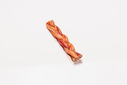 Natural braided bully stick shown on white background, sustainably sourced, digestible chew for dogs