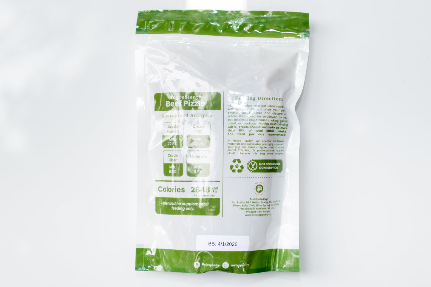 Back of Melico Pawtry Beef Pizzle dog treat bag showing ingredients, nutrition facts, feeding directions, recycling info, and best-by date 4/1/2026.