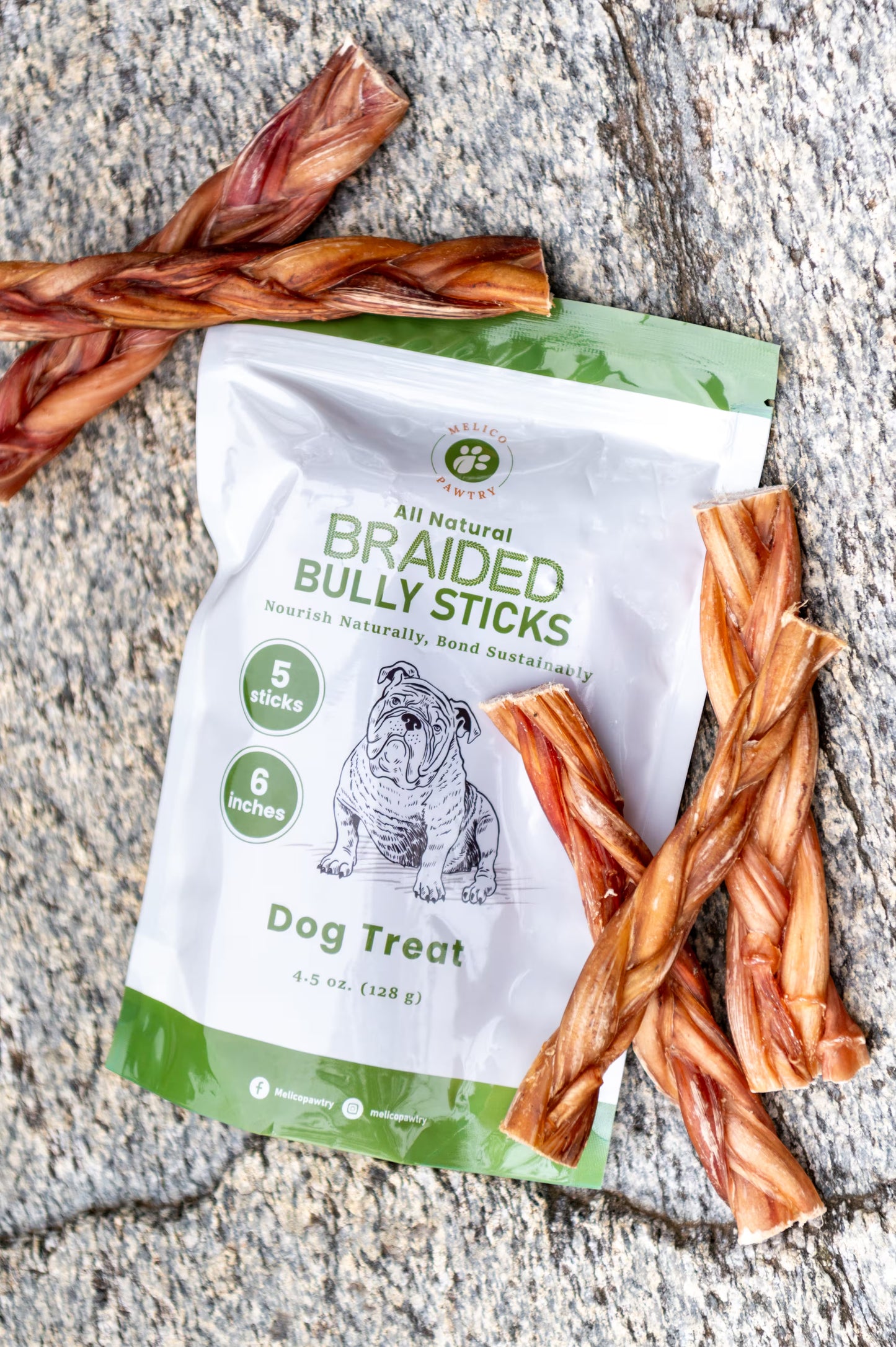 Package of All Natural Braided Bully Sticks dog treat with five sticks on a concrete surface